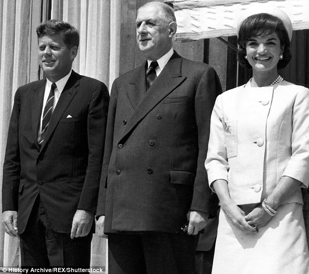 From left to right, President John F Kennedy, Charles De Gaulle, and Jackie Onassis Kennedy, pictured in her dress from the Cassini sketch 